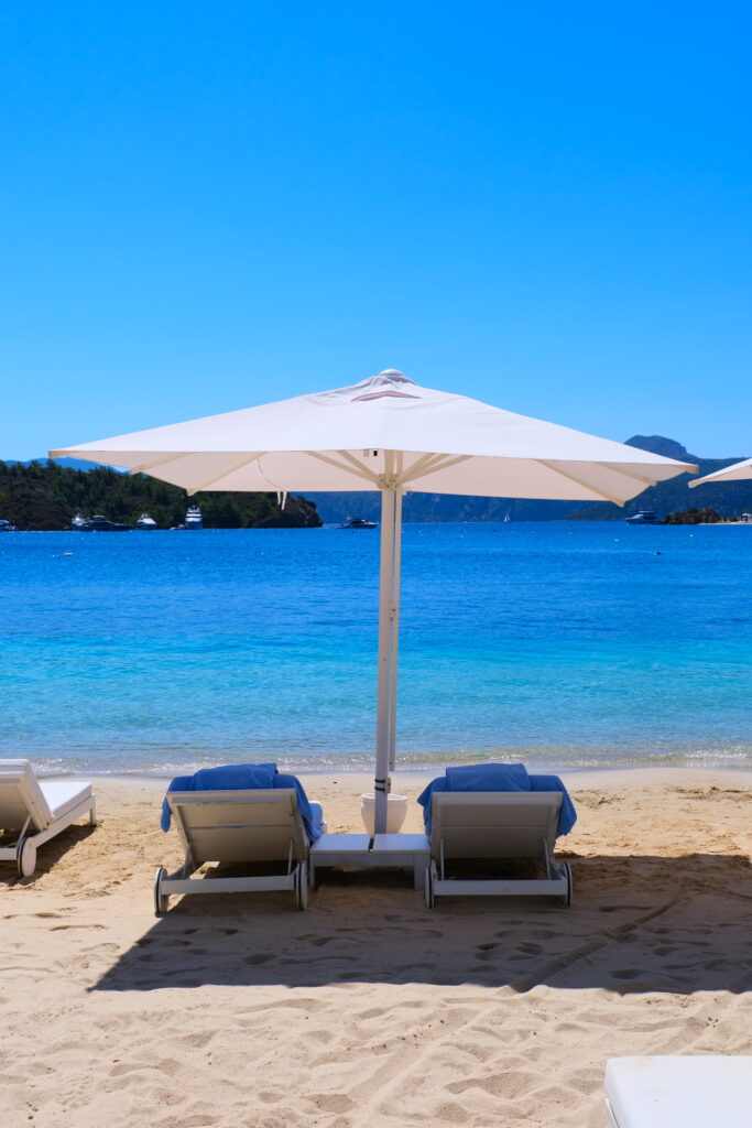 Sunbeds and umbrella by the sea