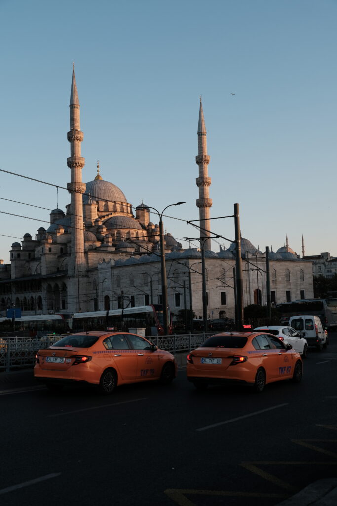The New Mosque at sunset, with Istanbul’s orange taxis